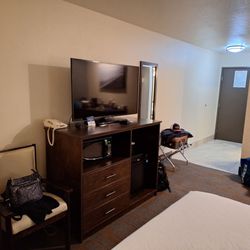 TV, mini fridge, microwave, table with two chairs, plenty of outlets available in the room