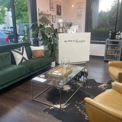 Waiting area and front desk. Super cute interior with indoor plants everywhere.