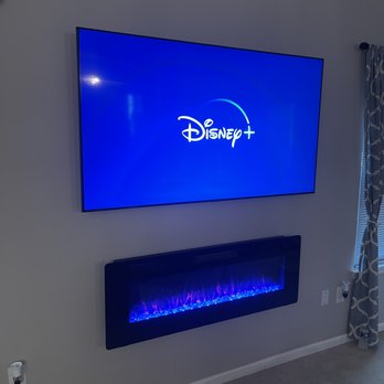 Quor Elite Tech - 65in wireless install with wall mounted fireplace - TV Mounting Near Me