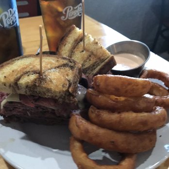 Turnpike’s Neighborhood Restaurant - Pastrami on fresh cut marble toast w/ fresh cut onion rings perfectly seasoned.... - Hot Dogs Near Me - Spring Hill, Florida Turnpike’s Neighborhood Restaurant - Pastrami on fresh cut marble toast w/ fresh cut onion rings perfectly seasoned.... - Hot Dogs Near Me - Spring Hill, Florida