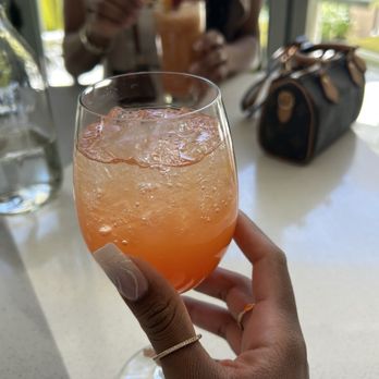 Overlook Grill - "Living My Best Life" spritz - passion fruit, Prosecco, & Aperol - Seafood Near Me - Las Vegas, Nevada Overlook Grill - "Living My Best Life" spritz - passion fruit, Prosecco, & Aperol - Seafood Near Me - Las Vegas, Nevada