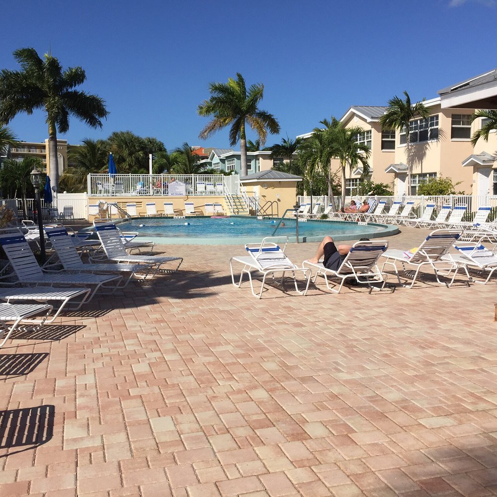 Barefoot Beach Vacation - Pool area. Condos in the background. Lovely. - Vacation Rentals Near Me - Indian Shores, Florida