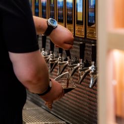 Smokin' Oak Wood-Fired Pizza & Taproom - Arkansas' first and largest self-pour taproom, where you can pour your own beer by the ounce using RFID bracelets.