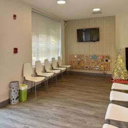Lil Pearls Pediatric Dentistry - Lobby area-- clean, big (more space around the corner) lots of games for little ones to wait an play with :)
