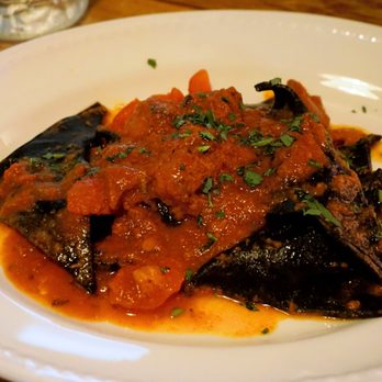 LIVIN'italy - Crab & Seabass Ink Ravioli: squid ink ravioli filled with seabass & crab meat, in a slow cooked tasty Mediterranean octopus ragu (£18.95). - Italian Near Me - Leeds, XWY LIVIN'italy - Crab & Seabass Ink Ravioli: squid ink ravioli filled with seabass & crab meat, in a slow cooked tasty Mediterranean octopus ragu (£18.95). - Italian Near Me - Leeds, XWY