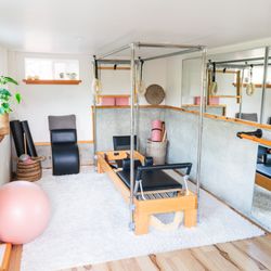Hilltop Pilates - Classical Pilates equipment includes full reformer set up.