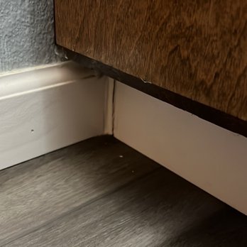 Joe's Floor Covering - He cut the baseboard too short so this is him fixing it. This is my view from the toilet - Flooring Near Me Joe's Floor Covering - He cut the baseboard too short so this is him fixing it. This is my view from the toilet - Flooring Near Me