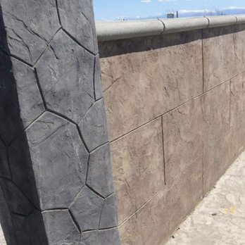 EN Custom Construction - stamped wall and pilar with regular color concrete bullnose top - General Contractors Near Me