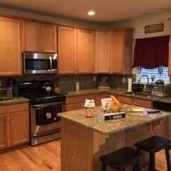 Baiza Construction - Add small kitchen island, new recess lights and backsplash.
