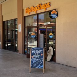 Flip Flop Shops - Lihue - Store front with a big Rainbow sandal!