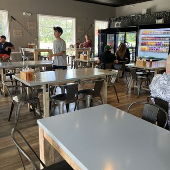 Cilantro's Gourmet Deli - Inside tables... high and low - Delis Near Me - Wellington, Florida Cilantro's Gourmet Deli - Inside tables... high and low - Delis Near Me - Wellington, Florida