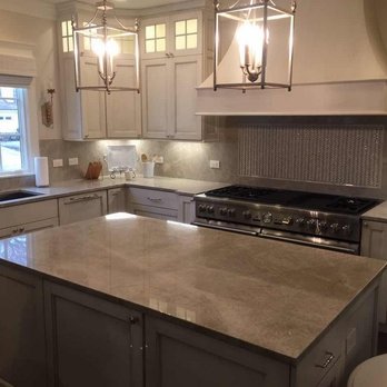 Taj Mahal Quartzite Countertops And Full Backsplash On White