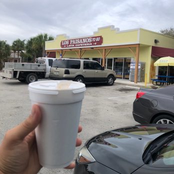 Los Paisanos To Go - a hand holding a cup of coffee - Latin American Near Me - Davie, Florida Los Paisanos To Go - a hand holding a cup of coffee - Latin American Near Me - Davie, Florida