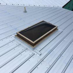 Florida Roof Masters - Skylight on exposed fastener Metal Roofing