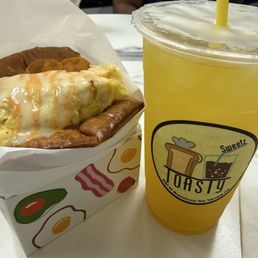 Sausage and egg sandwich, pineapple green tea Sausage and egg sandwich, pineapple green tea