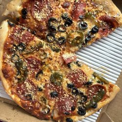 Theo's Neighborhood Pizza - Lunch special pizza with pepperoni, black olives and jalapeños.