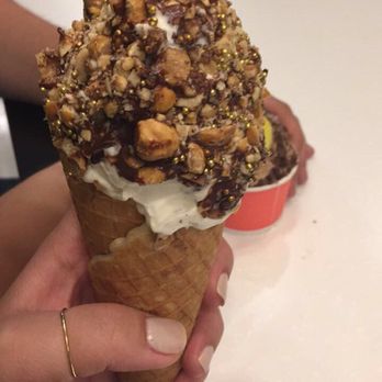 Churn Soft Serve - Michele Ferrero on a waffle cone. Vanilla ice cream dipped in chocolate with crushed hazelnuts. The cone was layered with Nutella! - Coffee & Tea Near Me - Buffalo, New York Churn Soft Serve - Michele Ferrero on a waffle cone. Vanilla ice cream dipped in chocolate with crushed hazelnuts. The cone was layered with Nutella! - Coffee & Tea Near Me - Buffalo, New York