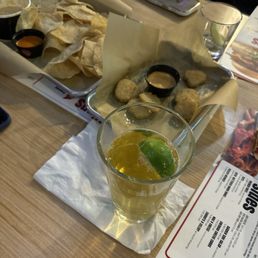Fried pickles and chips with hatch queso