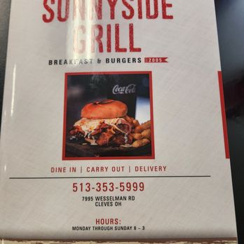 Sunnyside Grill - Menu - The image shows a menu cover for Sunnyside Grill, a restaurant offering breakfast and burgers. The cover features the restaurant's name in large red letters, a photo of a burger with fries, and details about dine-in, carry-out, and delivery options. The contact number and address are also included, along with the hours of operation from Monday to Sunday, 8 am to 3 pm. - American Near Me - Cleves, Ohio