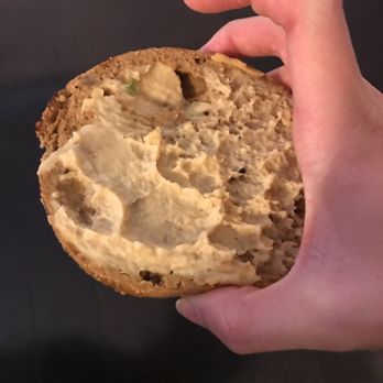 Offerdahl's Off-The-Grill - Pictured here is half of an 8-grain bagel with hummus. Delicious! - Sandwiches Near Me - Weston, Florida Offerdahl's Off-The-Grill - Pictured here is half of an 8-grain bagel with hummus. Delicious! - Sandwiches Near Me - Weston, Florida