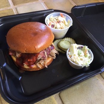 Iron Door BBQ and Grill - Pulled Pork Sandwich with coleslaw "out" and coleslaw on the side - Barbeque Near Me Iron Door BBQ and Grill - Pulled Pork Sandwich with coleslaw "out" and coleslaw on the side - Barbeque Near Me