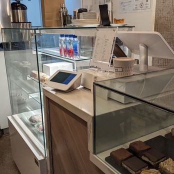 Black Wolf Coffee - a counter with a variety of pastries - Coffee & Tea Near Me - Toronto, Ontario