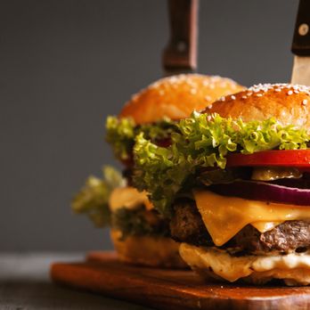 River Ratz Saloon - a cheeseburger on a cutting board - Sports Bars Near Me - Cochrane, Wisconsin River Ratz Saloon - a cheeseburger on a cutting board - Sports Bars Near Me - Cochrane, Wisconsin