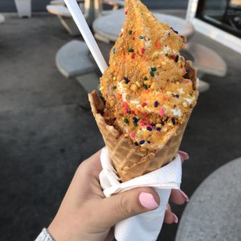 Twist - a hand holding an ice cream cone with sprinkles - Ice Cream & Frozen Yogurt Near Me - Greenville, Wisconsin Twist - a hand holding an ice cream cone with sprinkles - Ice Cream & Frozen Yogurt Near Me - Greenville, Wisconsin