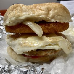 Delio's Deli Grille - Sausage egg and cheese. Fried onions, tomato and hash brown.