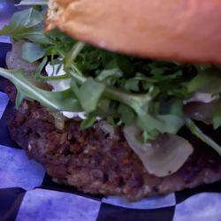 Sneaky’s Bar & Burger Joint - The G.O.A.T. Burger with impossible patty