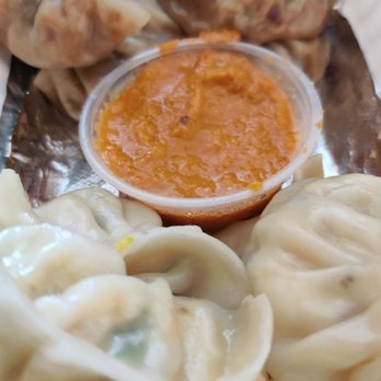 Streetside Munchies - a plate of dumplings and sauce - Chinese Near Me - Brampton, Ontario