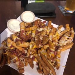 Clubhouse Sports Bar & Grill - HUGE cheese fries with bacon bits