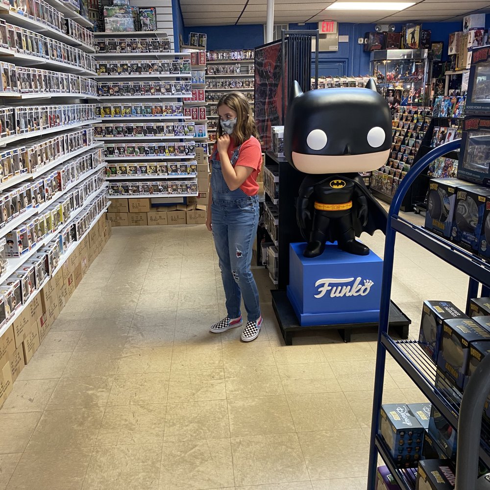Too busy looking at Pop figures to pose for the picture.
