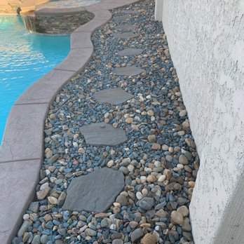 Regalado Landscape - River rock by pool - Landscaping Near Me