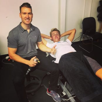 Back to Action Chiropractic - Ethen getting percussion muscle therapy before his swim meet. - Chiropractors Near Me - Tustin, California Back to Action Chiropractic - Ethen getting percussion muscle therapy before his swim meet. - Chiropractors Near Me - Tustin, California