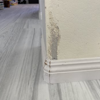 Rozak Flooring - Destroyed drywall from pulling baseboards, they did not repair it properly - Flooring Near Me