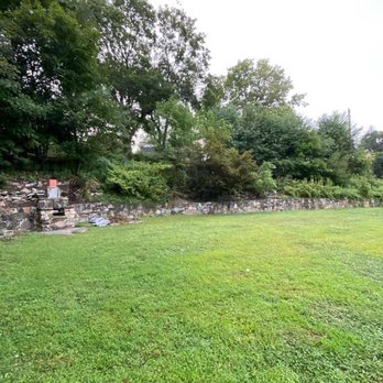 Kane Property Management - Before, above our retaining wall was over grown with weeds - Landscaping Near Me Kane Property Management - Before, above our retaining wall was over grown with weeds - Landscaping Near Me