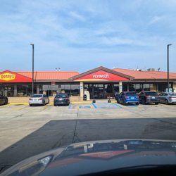 Flying J Travel Plaza - Outside. Convenience store storefront. Denny's restaurant attached.