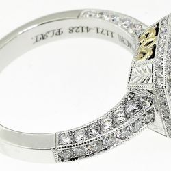 Sapphire and diamond ring with hand engraving.
