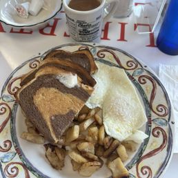 Two 2 Eggs, Home Fries and Toast over easy with rye toast Two 2 Eggs, Home Fries and Toast over easy with rye toast