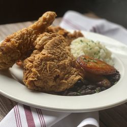 Chao Pescao - Tajin Fried Chicken: hree-pieces free-range local poultry, mexican spices, lime, hot sauce - served with black beans, rice & plantains