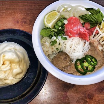 Phovana - Phó with tripe, flank, rare steaks, tendon, meatballs, sliced onion, green onion, jalapeño, bean sprouts, basil leaves and a steamed bun - Vietnamese Near Me - Amherst, New York
