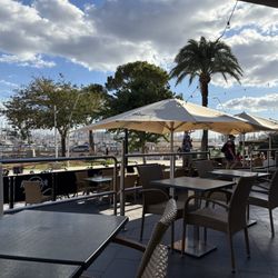 Hard Rock Cafe - Outdoor seating with a view of many boats & yachts