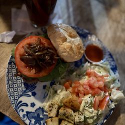 Micky's Joint - Za'tar grilled chicken sandwich special with hot honey and grilled onions and side of hot sriracha honey mustard and Caesar side