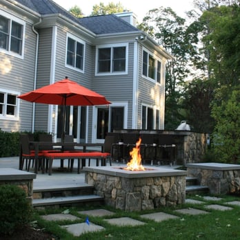 Ambrosio Landscape Solutions - a patio with a fire pit - Landscape Architects or Designers Near Me - Redding, Connecticut