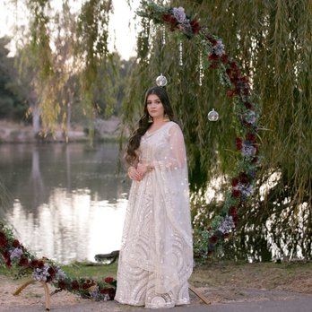 An Elegant Standard - round backdrop with floral decor and round teadrops - Party & Event Planning Near Me An Elegant Standard - round backdrop with floral decor and round teadrops - Party & Event Planning Near Me