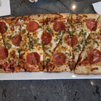 Fountain Wine Bar - Flatbread, pepporoni, olive, hot honey. - Wine Bars Near Me - Seattle, Washington Fountain Wine Bar - Flatbread, pepporoni, olive, hot honey. - Wine Bars Near Me - Seattle, Washington