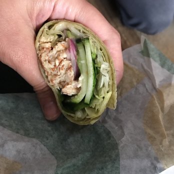 Subway - a hand holding a chicken salad wrap - Sandwiches Near Me - Aberdeen, Washington Subway - a hand holding a chicken salad wrap - Sandwiches Near Me - Aberdeen, Washington