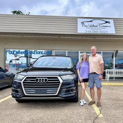 Four Wheel Solutions - Mike Sheffield, Owner of Four Wheel Solutions, with an excited customer and her new-to-her Audi Q7!