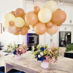 DreamARK Events - Gender Reveal Party Decoration with nutural balloon designs and pink and blue floral centerpieces